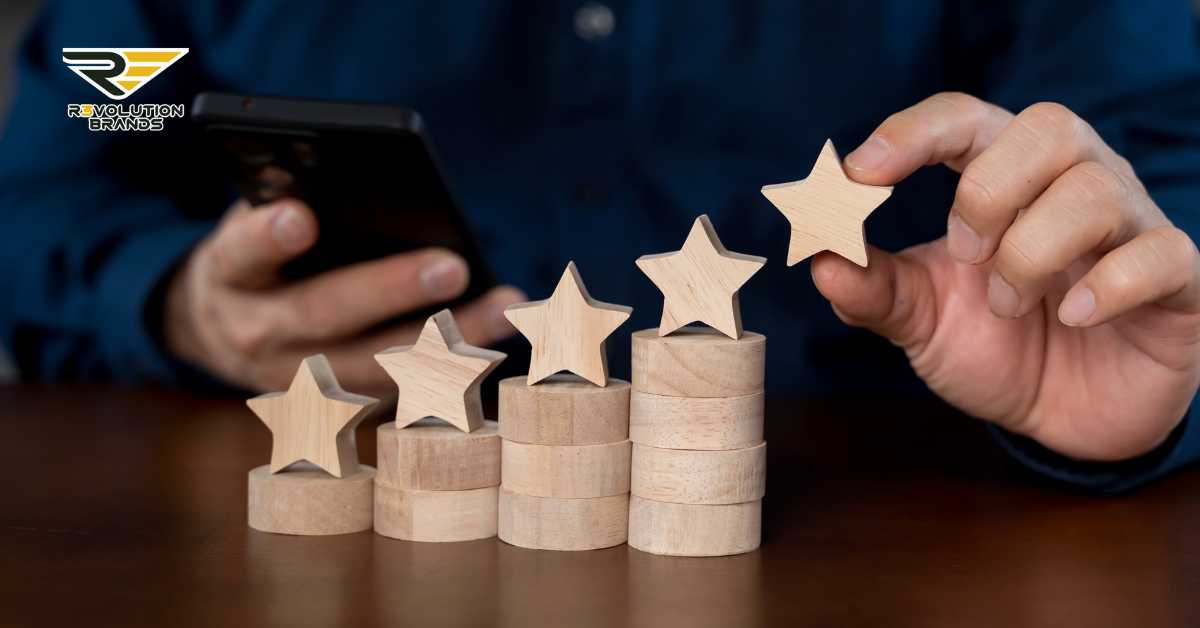 Close-up image of a person placing a wooden star on top of a stack of circular blocks, with other stacks showing varying numbers of stars, symbolizing rating or performance levels. The person, partially visible, is also using a smartphone, possibly for recording or reviewing ratings. The R3volution Brands logo in the upper left corner signifies a focus on personalized consumer experiences in franchising.