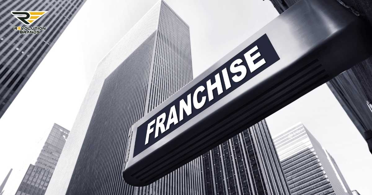 This image prominently features a sleek, modern sign with the word "FRANCHISE" set against a backdrop of towering skyscrapers. The composition conveys a strong corporate or urban environment, symbolizing the growth and expansion of franchise businesses within major cities. The inclusion of the R3volution Brands logo suggests a focus on the evolution and future of franchising, highlighting the company's role in shaping this industry sector. The stark, professional tone of the image underscores the significant influence and modern approach of franchise businesses in today's economic landscape.