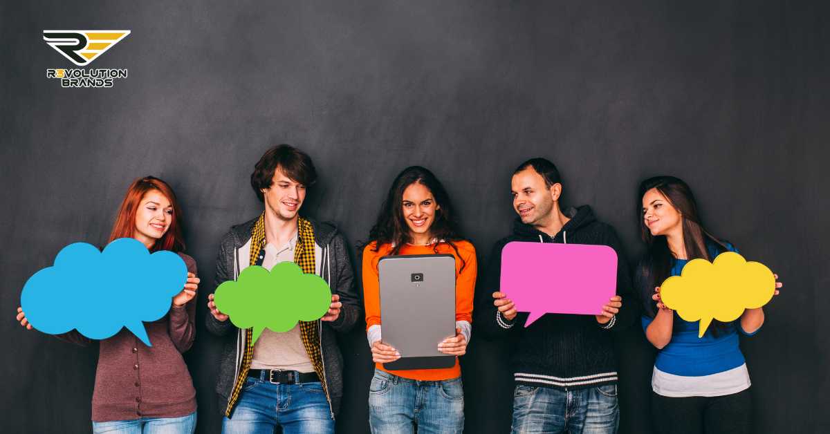 Group of young, diverse R3volution Brands team members holding colorful speech bubbles, representing the impact of social media on franchising strategies for success.